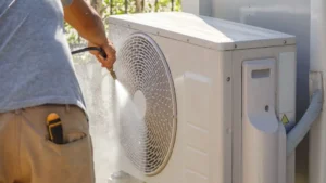 man-cleaning-outdoor-unit